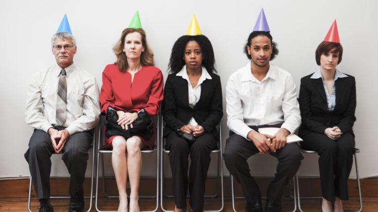 A group of business colleagues sitting awkwardly at an office party