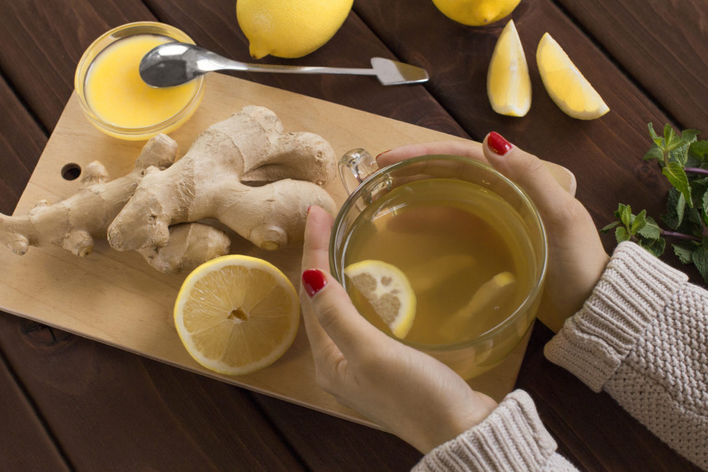 Ginger and lemon tea on wooden table