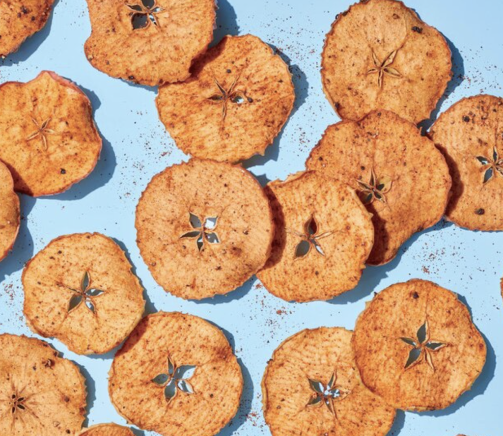 Sweet and Spicy Apple chips on a blue background. 