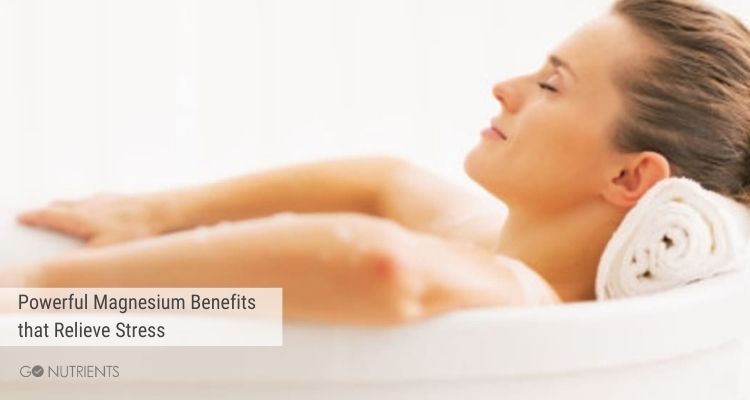 Powerful Magnesium Benefits that Relieve Stress  -  Woman relaxing in a white bath with white background. 