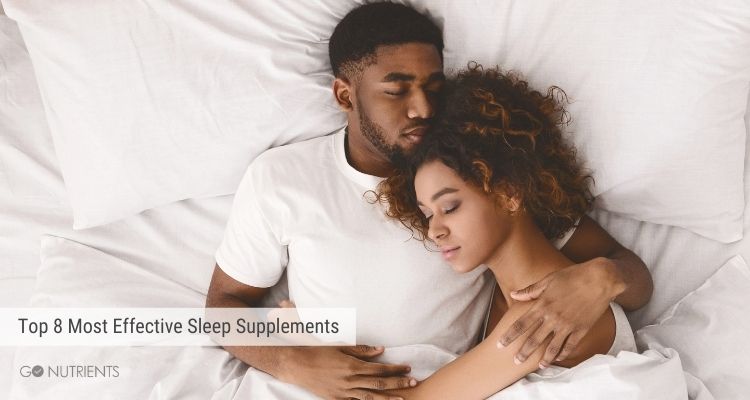 Top 8 Most Effective Sleep Supplements - Young African American couple sleeping with all white linens.  