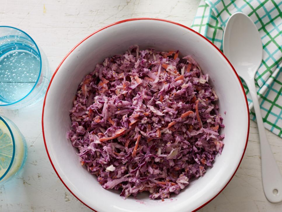 Healthy chopped slaw in a bowl with spoon. 