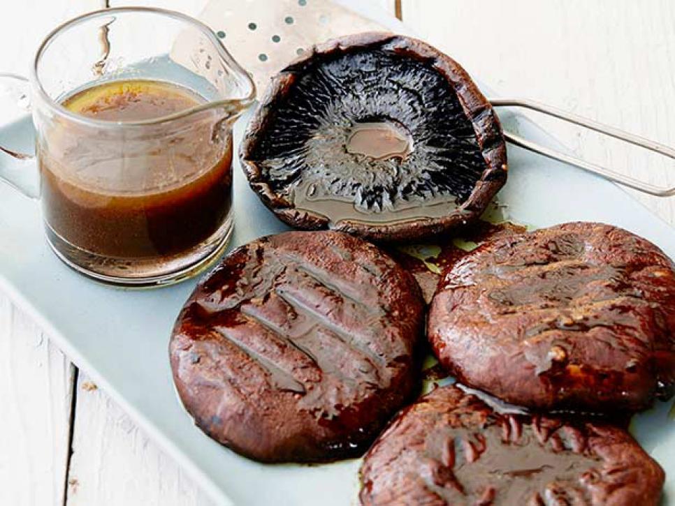 Grilled portobello mushrooms with balsamic displayed on a platter. 
