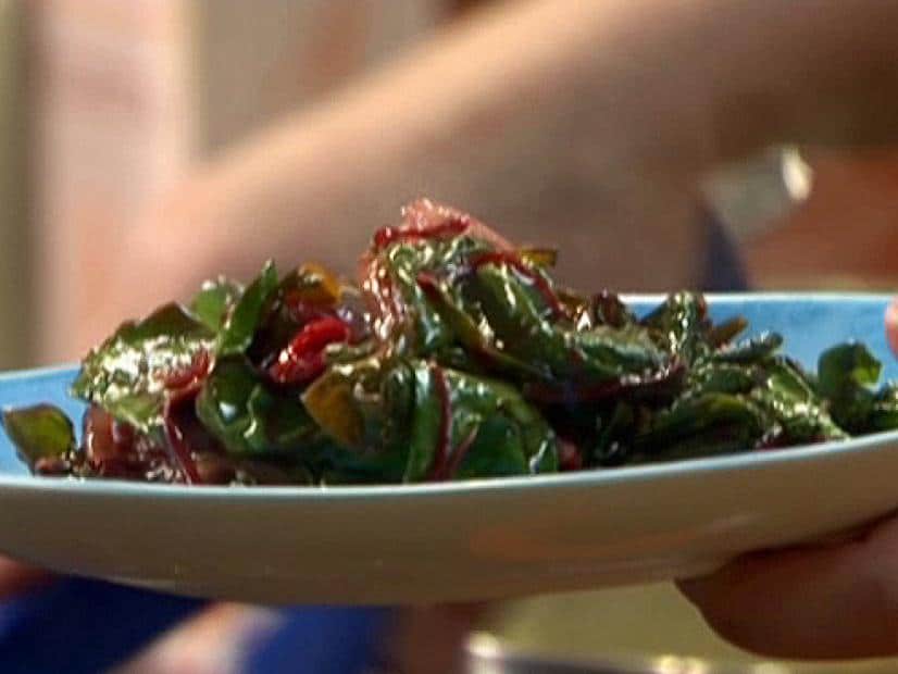 Dark greens and cranberries plated by Rachel Ray