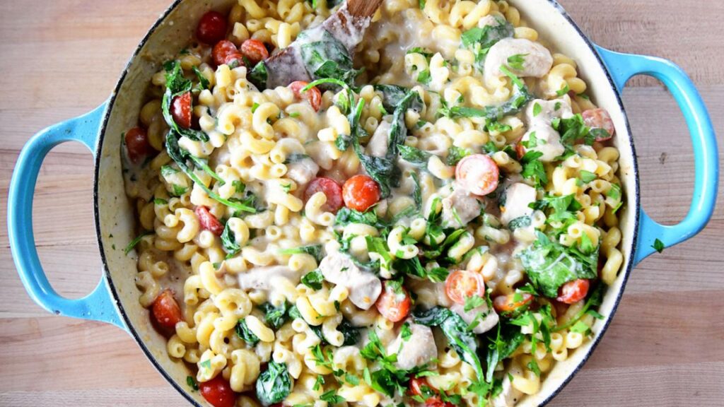 Chicken Florentine Mac and Cheese kid-friendly recipe.  Cooked and displayed in a round pot.  